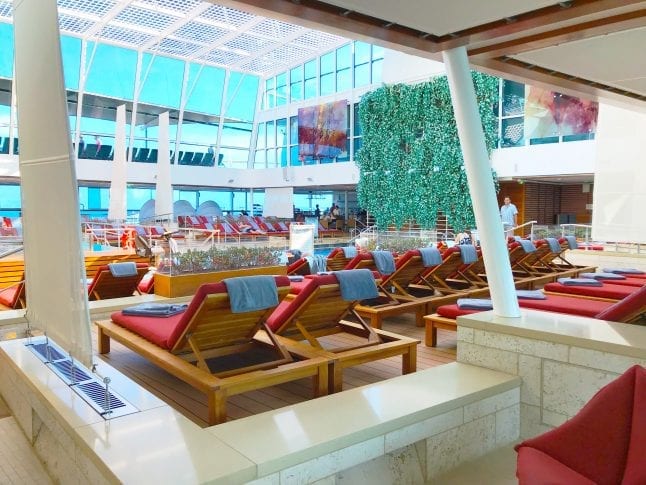 Bask in the peace and serenity of Celebrity Reflection's Solarium.