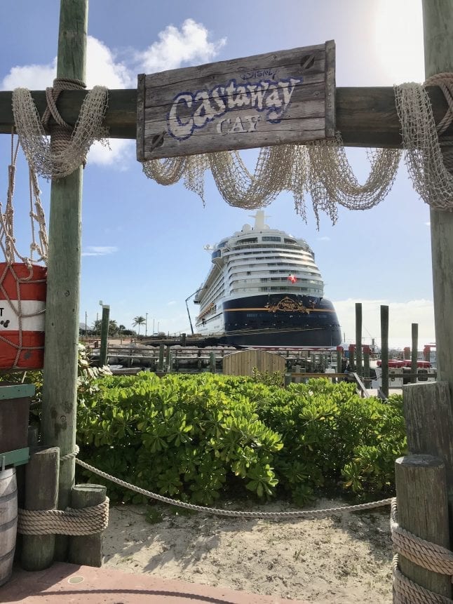 Disney Dream framed by signage for Castaway Cay.