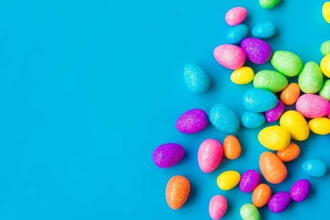 Glittering Easter eggs on a blue background.